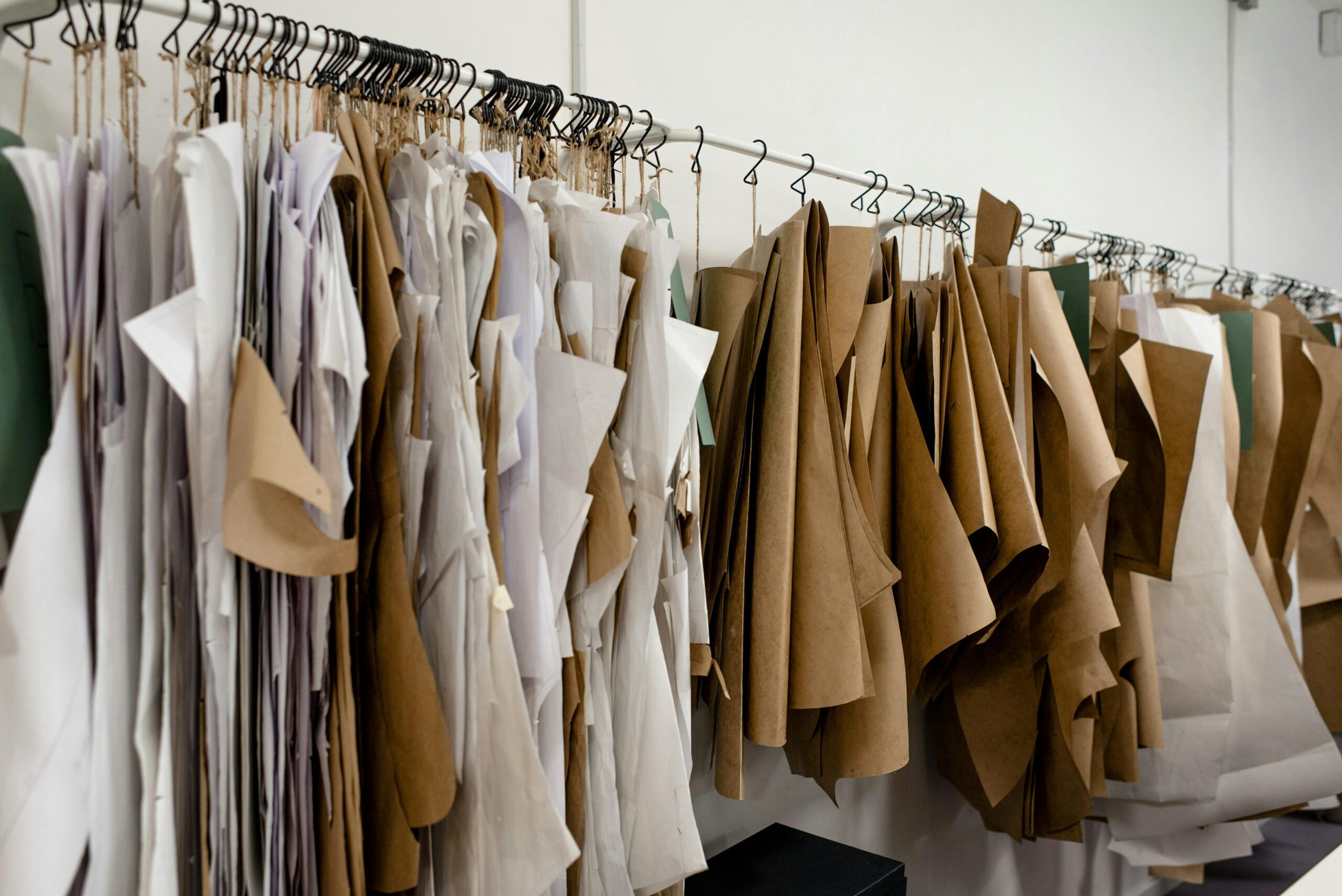 hundreds of patterns of garments hung on hangers