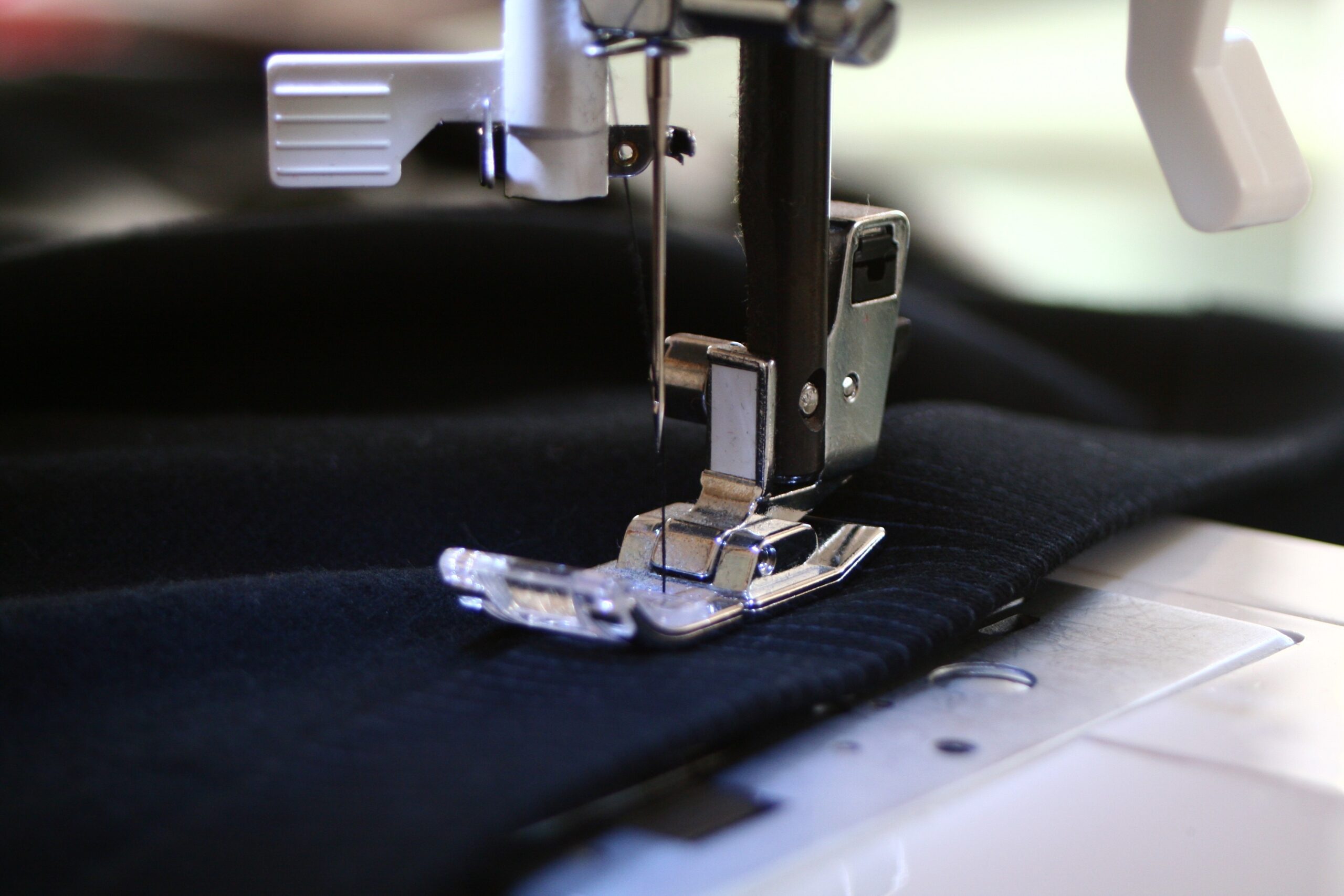 garment being stitched on a sewing machine